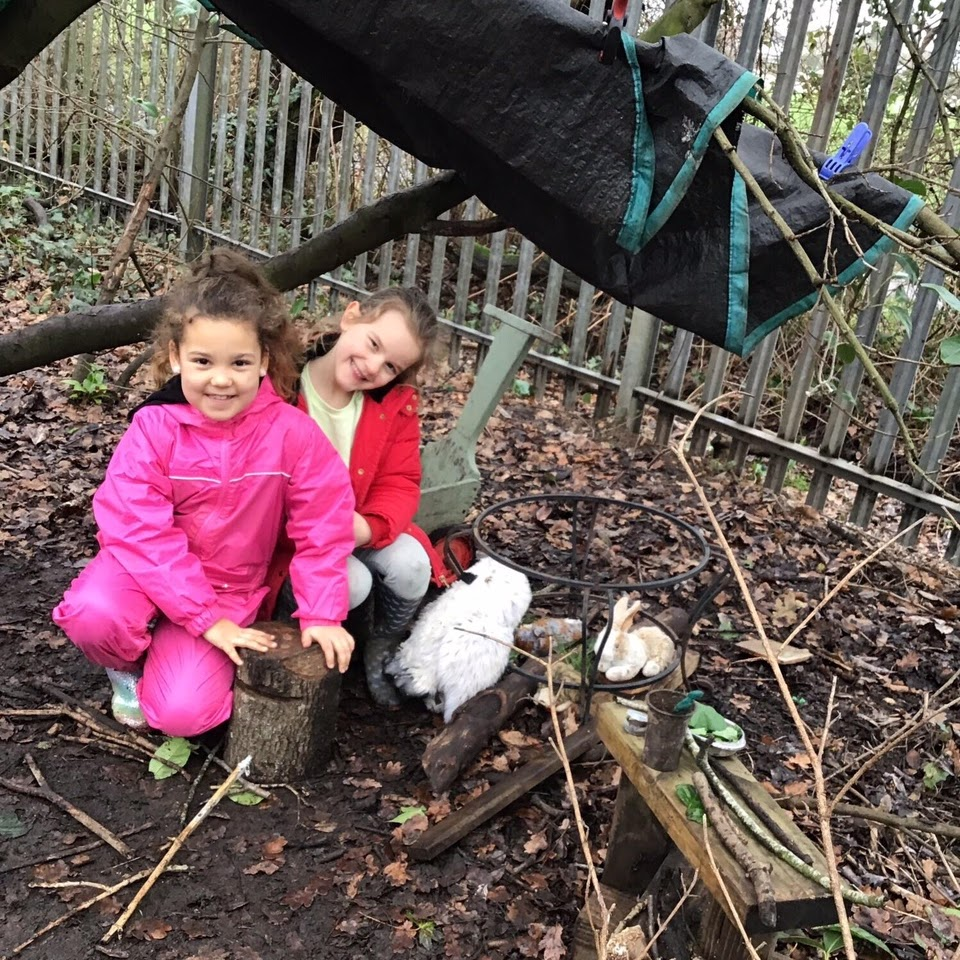 Children sat under a shelter