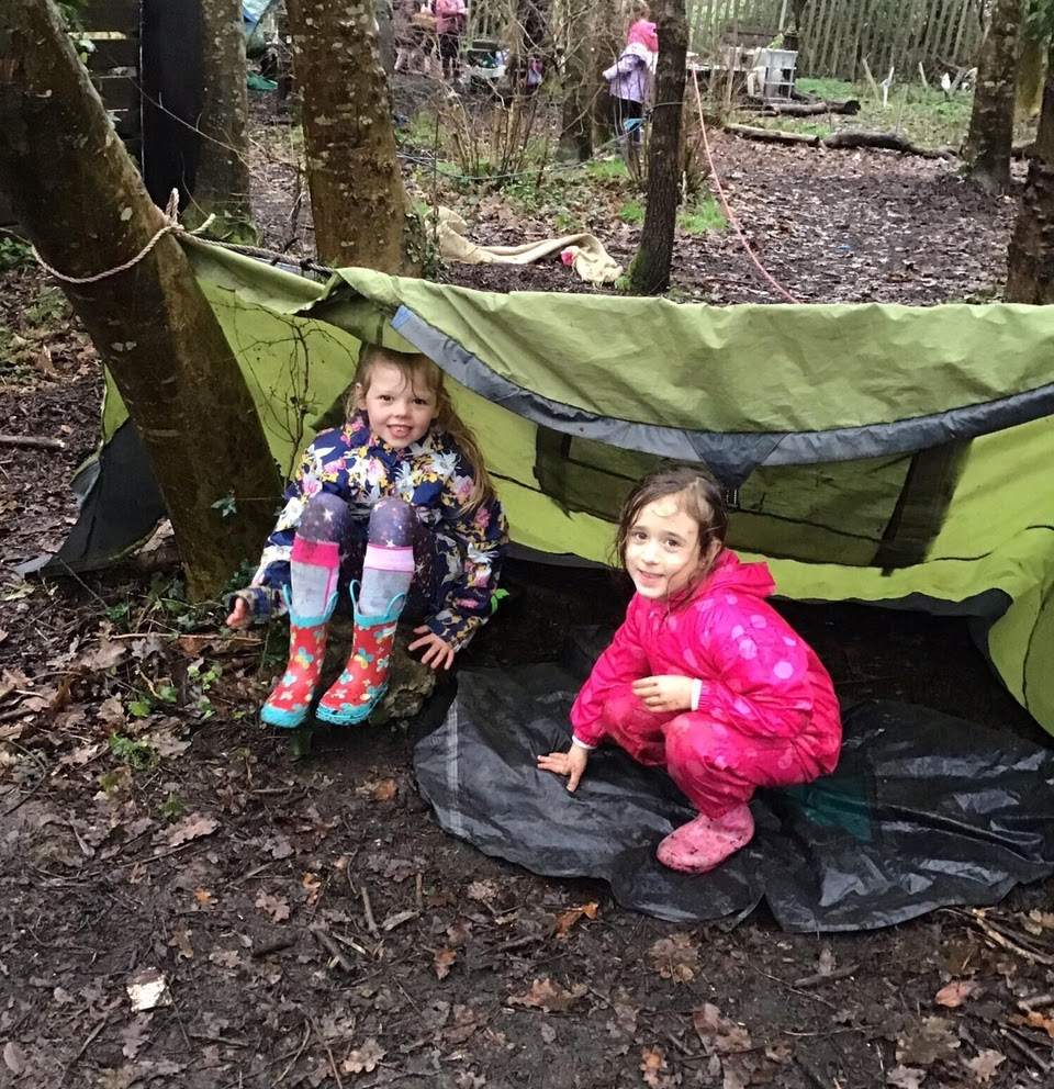 Two girls under a shelter