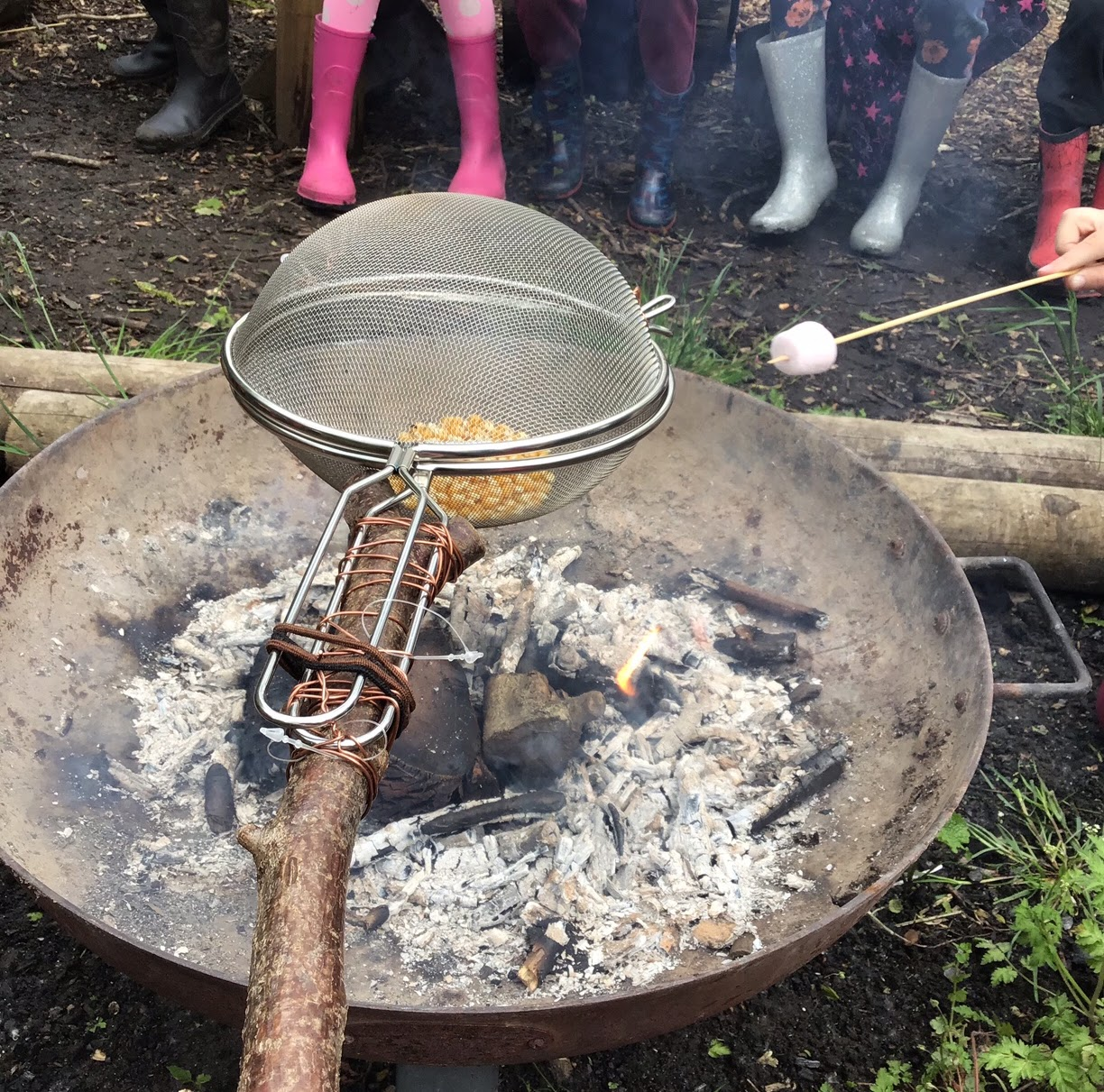 Popcorn cooking over the campfire