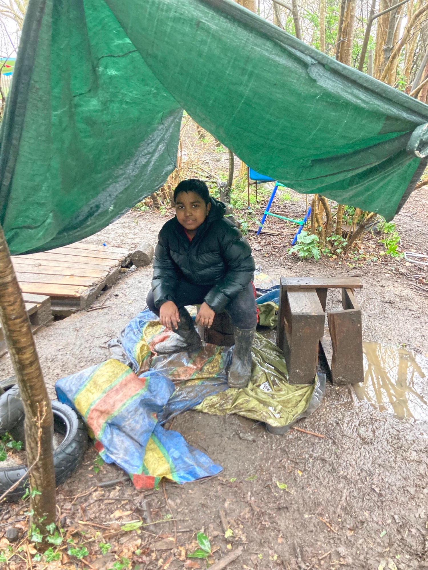 A boy under a shelter