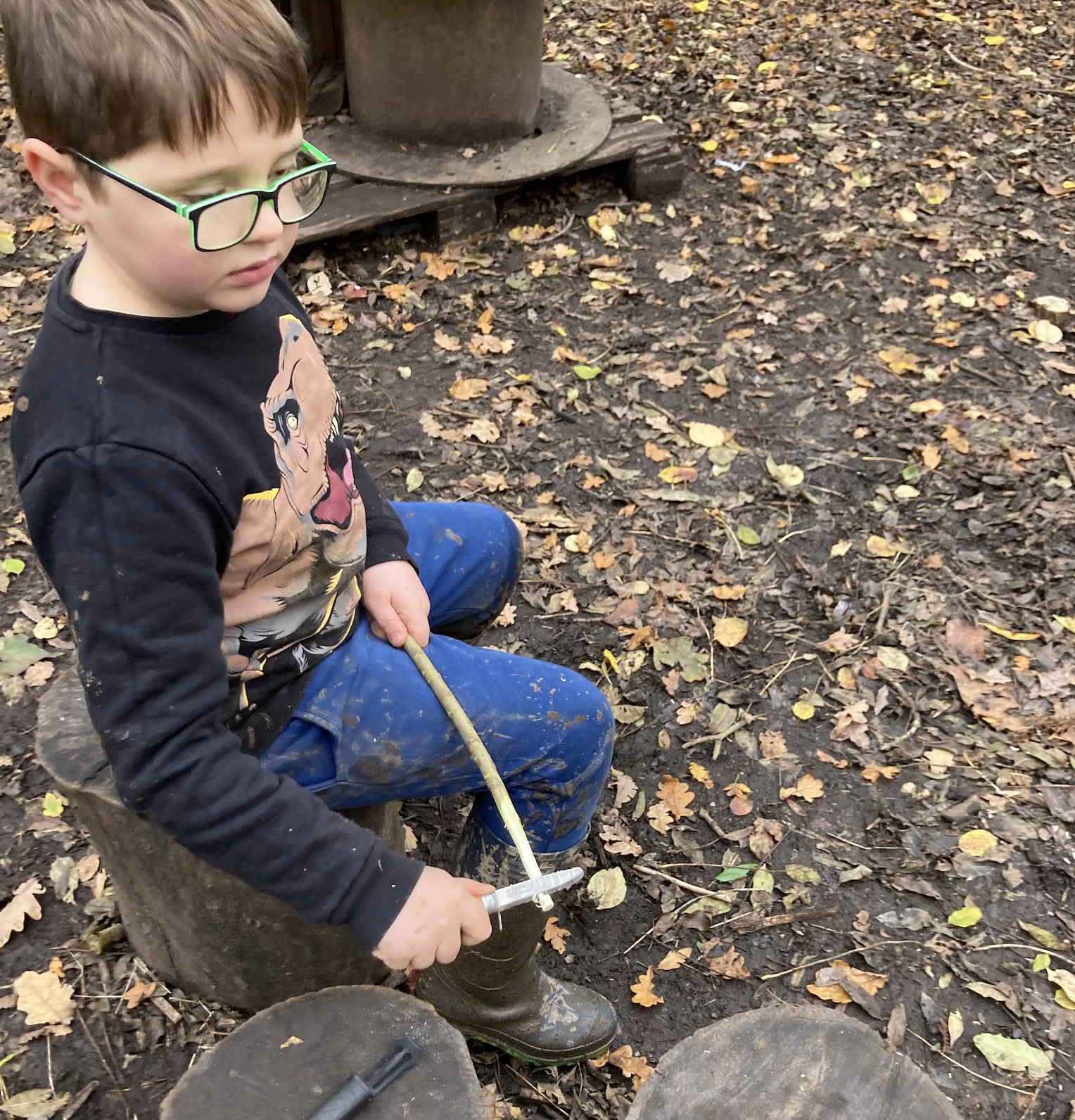 A child whittling a stick